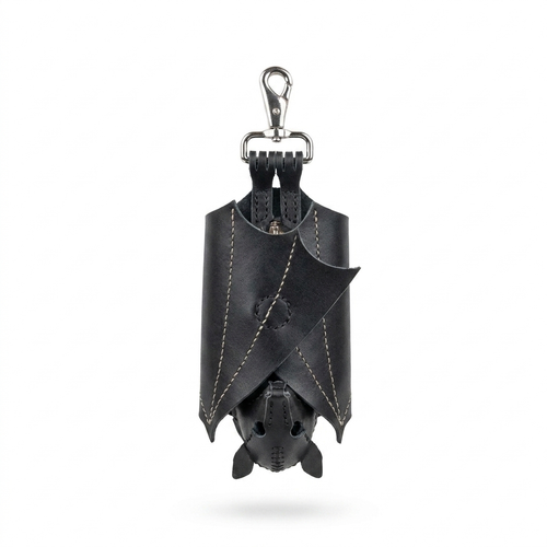 Bat coin purse with wings folded shut, hanging vertically from its silver snap hook